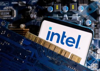 FILE PHOTO: A smartphone with a displayed Intel logo is placed on a computer motherboard in this illustration taken March 6, 2023. REUTERS/Dado Ruvic/Illustration/File Photo